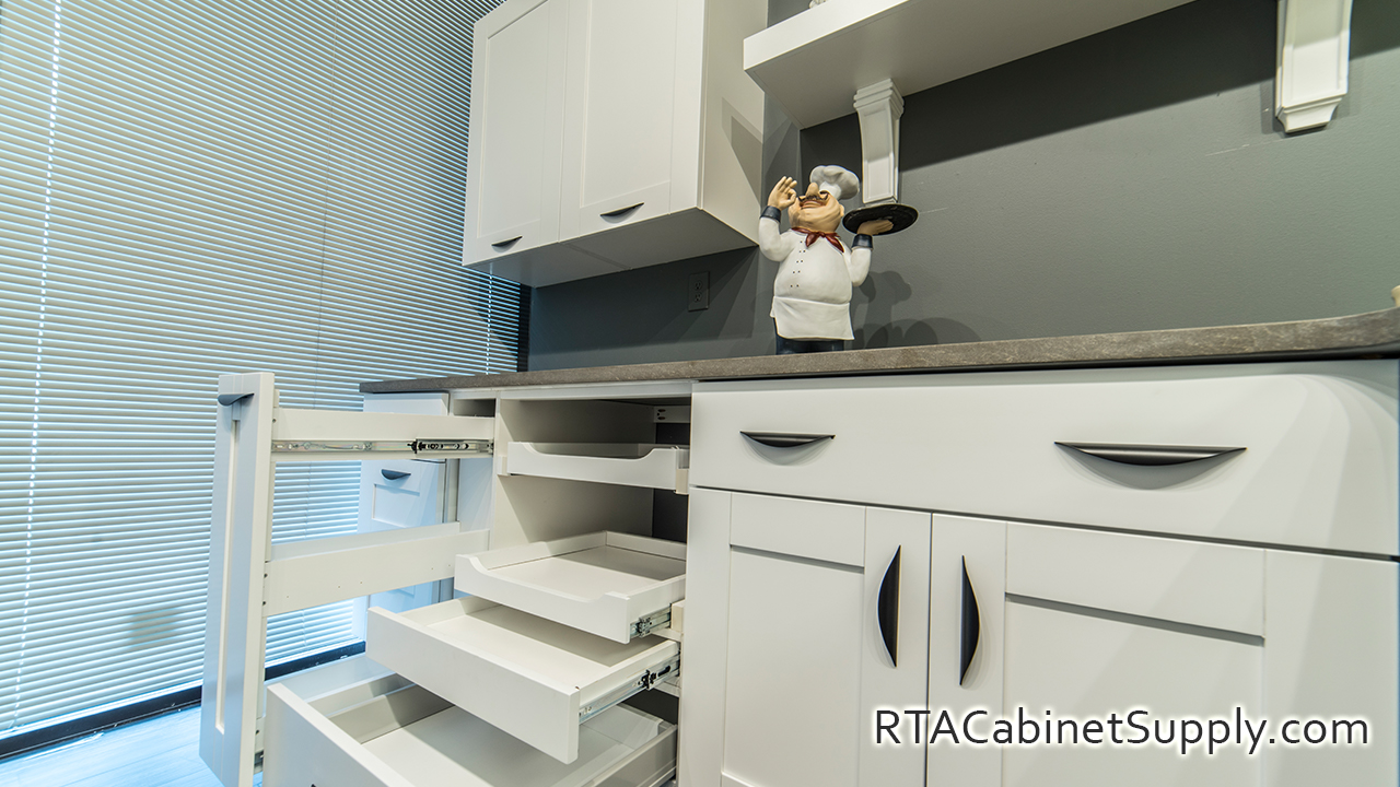 Anchester White kitchen angle view with open base cabinets.