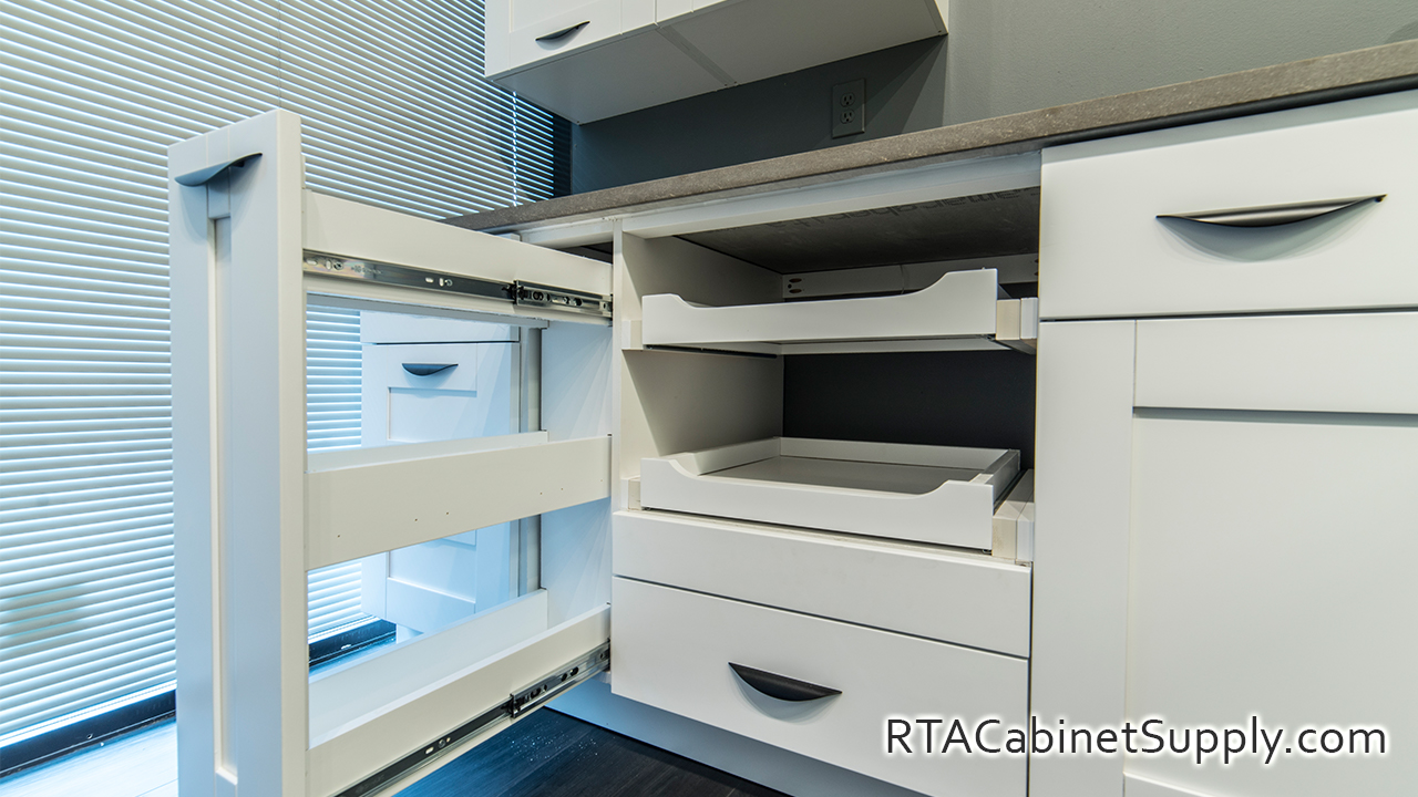 Anchester White kitchen close up angle view with open base cabinets.