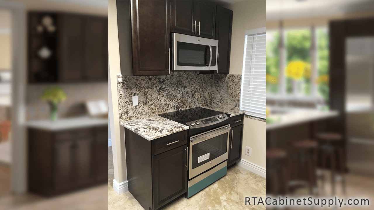 Concord Espresso Glaze kitchen angle view with an oven, wall and base cabinets.