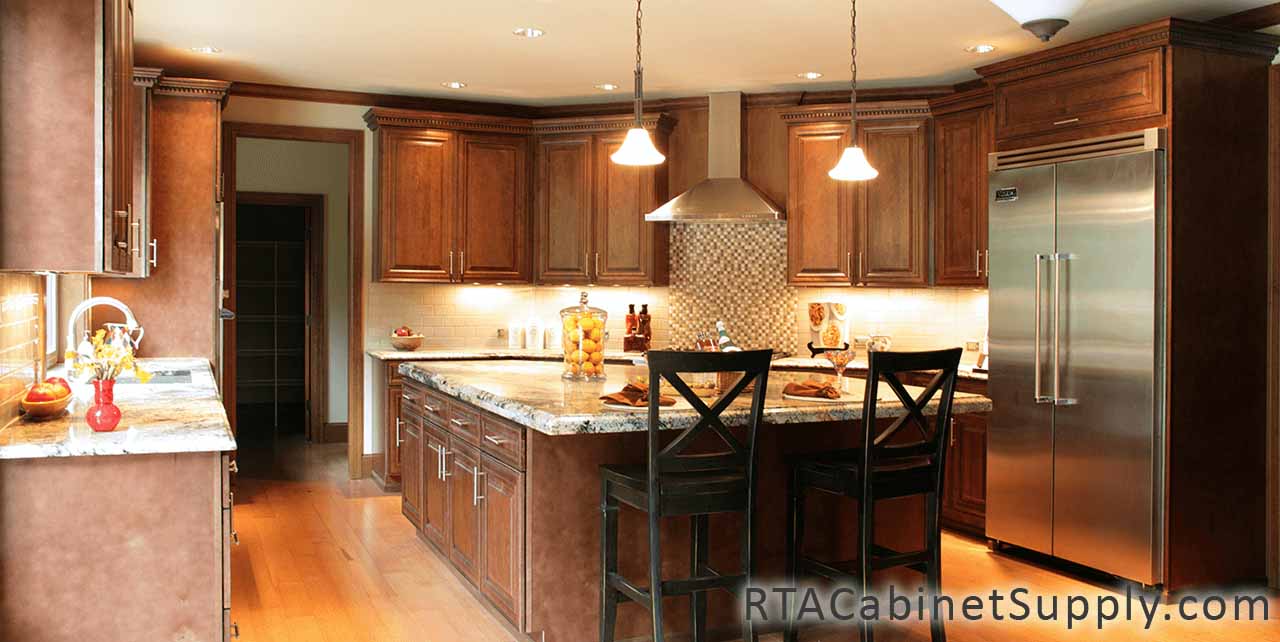 Jackson Chocolate Glaze Cabinet Line kitchen close up view with an island, a fridge, wall and base cabinets.