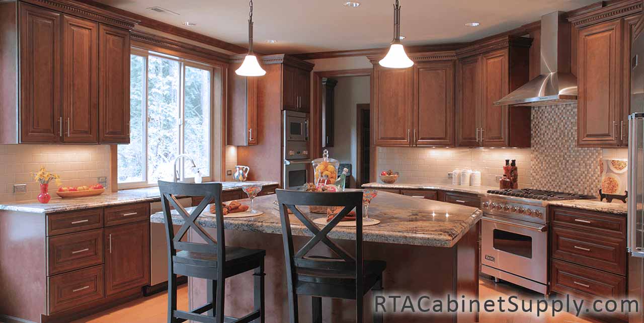Jackson Chocolate Glaze Cabinet Line kitchen close up view with an island, an oven, a range hood, wall and base cabinets.