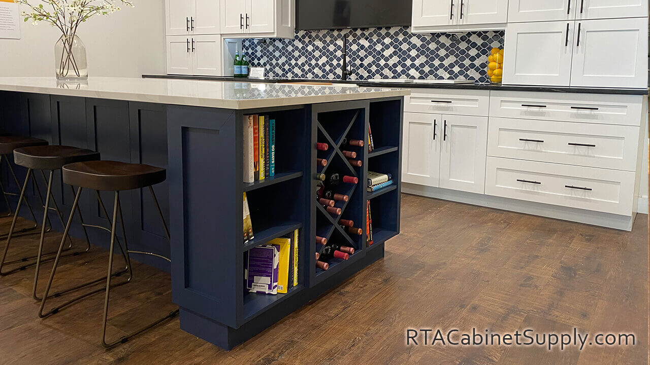 Madison Blue Shaker kitchen close up view with an island, chairs, open shelves and a wine rack cabinet.
