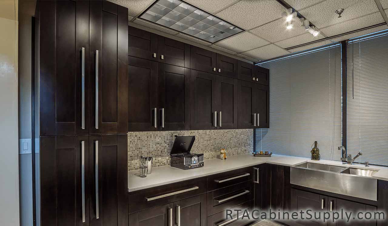 Anchester Espresso kitchen angle view with pantry, wall and base cabinets.