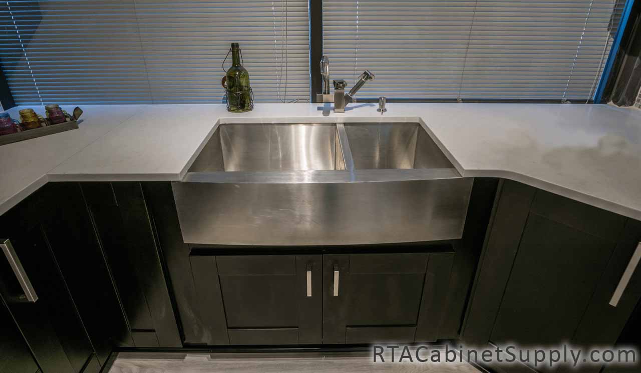 Anchester Espresso kitchen close up view with a farmhouse sink base cabinet.