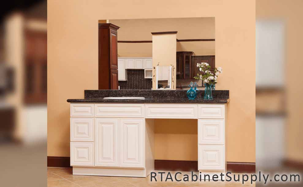 Charleston Cream bathroom close up view with a mirror and base cabinets.