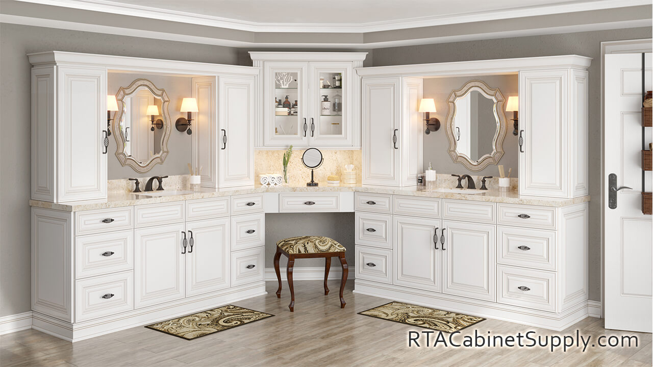 Charleston Cream bathroom full view with two mirrors, glass door cabinet, wall and base cabinets.