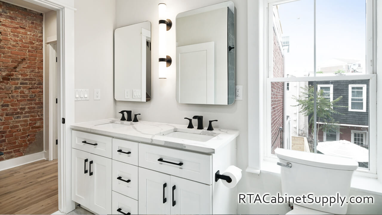 Classic White Shaker bathroom close up angle view with two mirrors, two sinks and base cabinets.