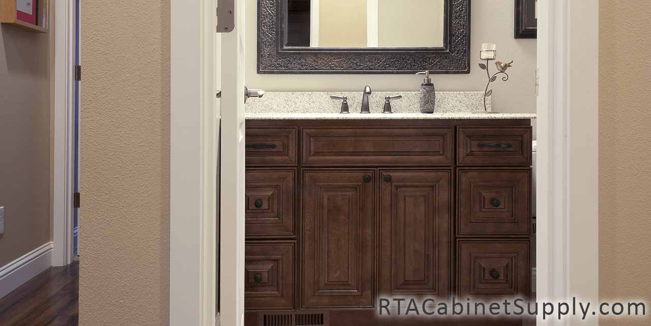 Jackson Chocolate bathroom close up view with a mirror and base cabinets.