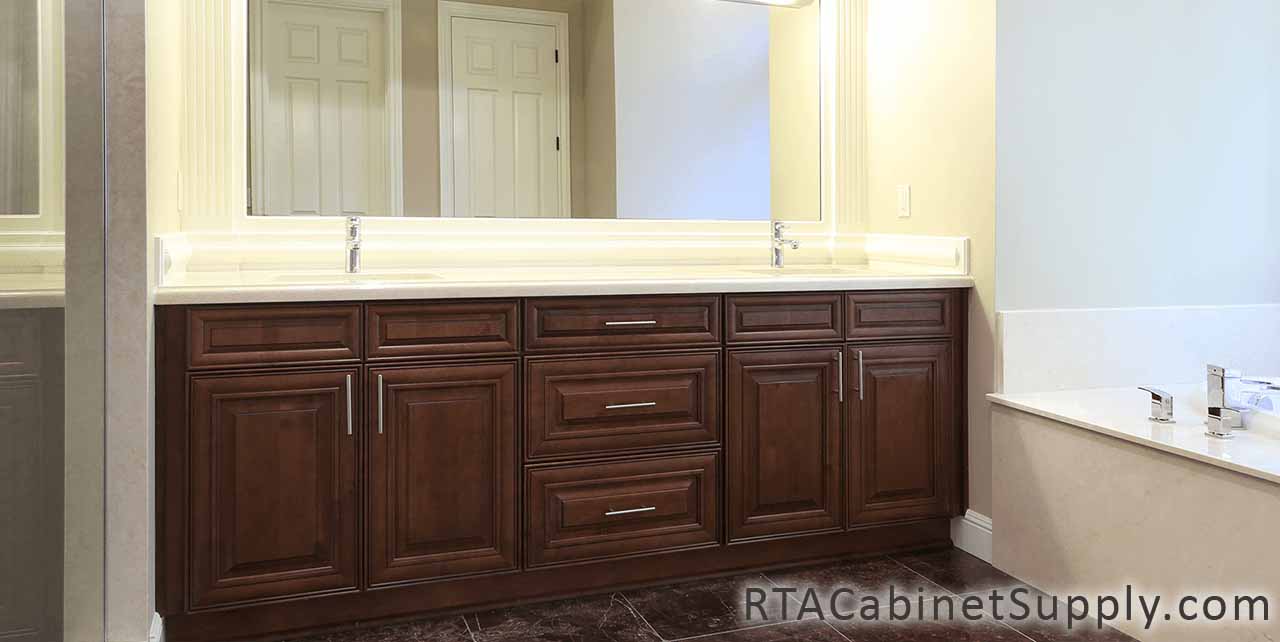 Jackson Chocolate bathroom full view with a mirror, two sinks and base cabinets.