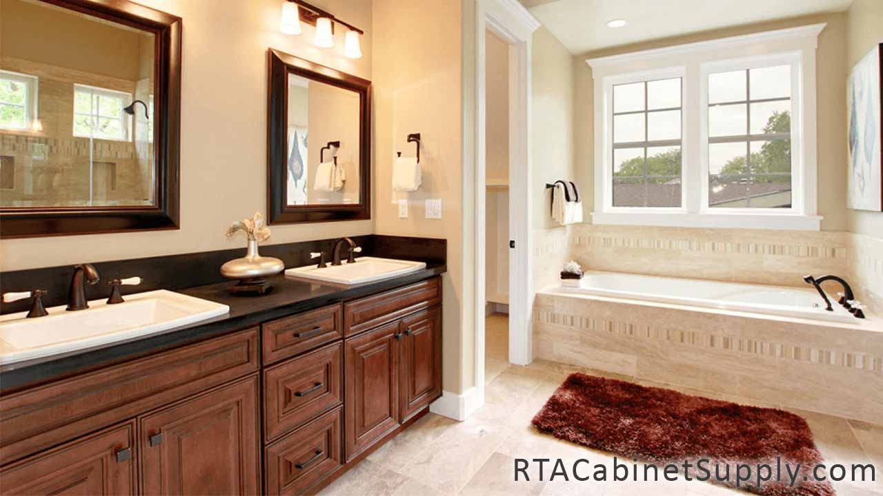 Jackson Chocolate bathroom angle view with a bathtub, two mirrors, two sinks and base cabinets.
