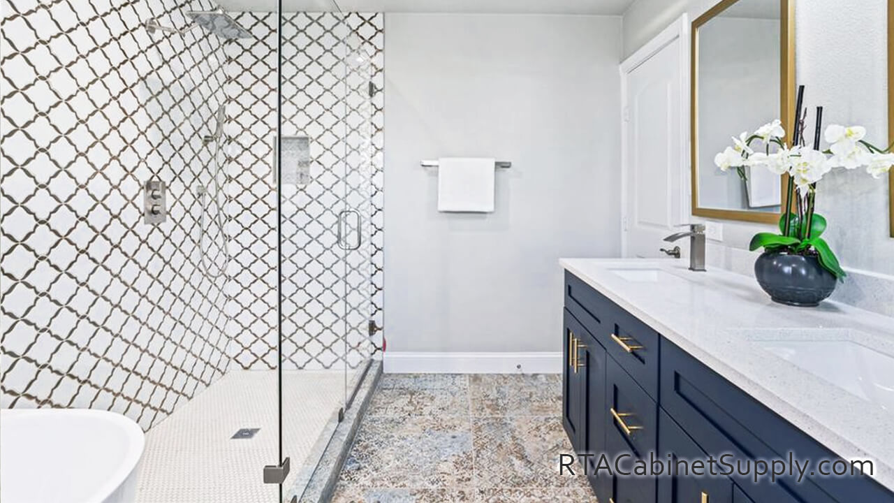 Madison Blue Shaker bathroom angle view with shower, a mirror and base cabinets.
