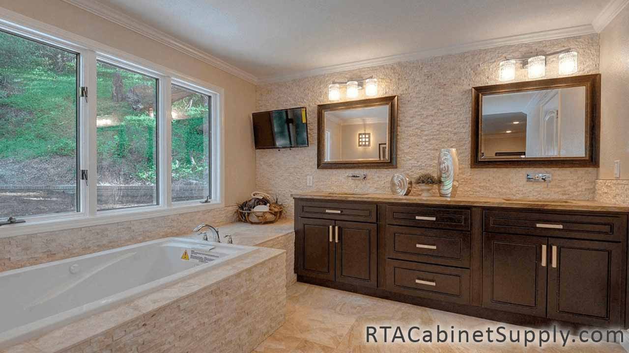 Modern Espresso bathroom close up angle view with a bathtub, two mirrors, two sinks and base cabinets.