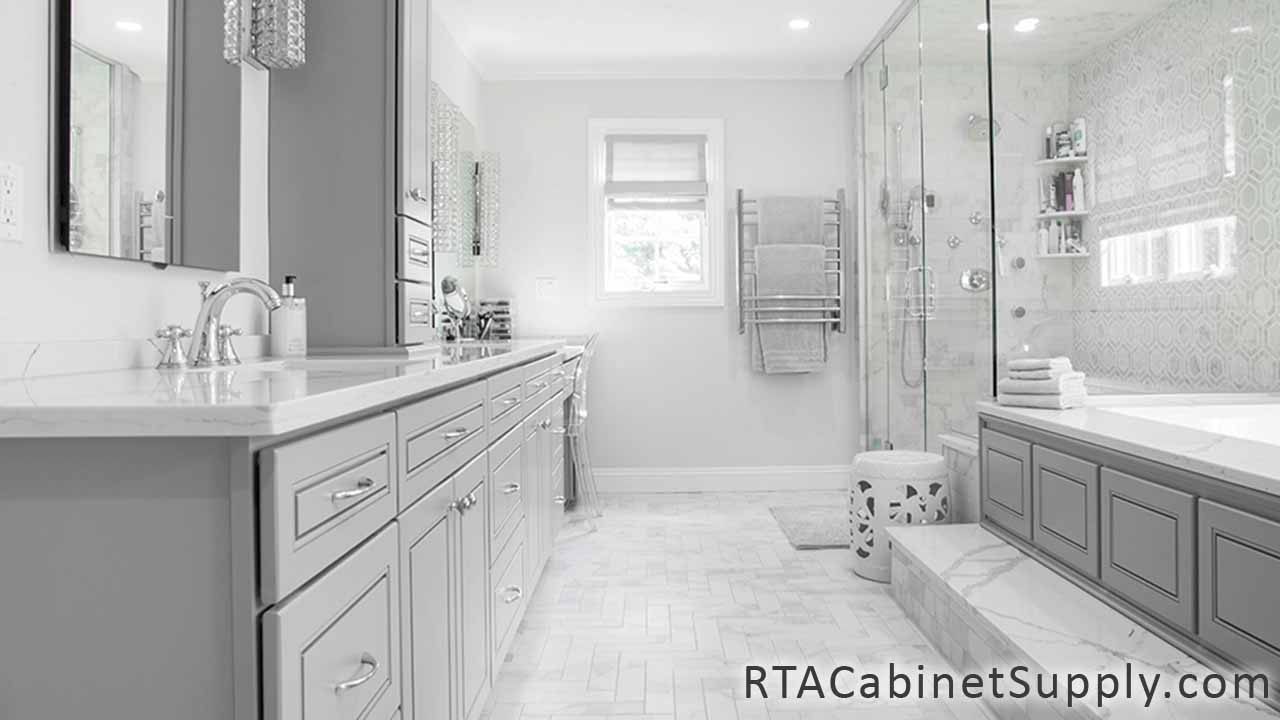 Modern Grey bathroom close up view with a sink, a mirror, shower and base cabinets.