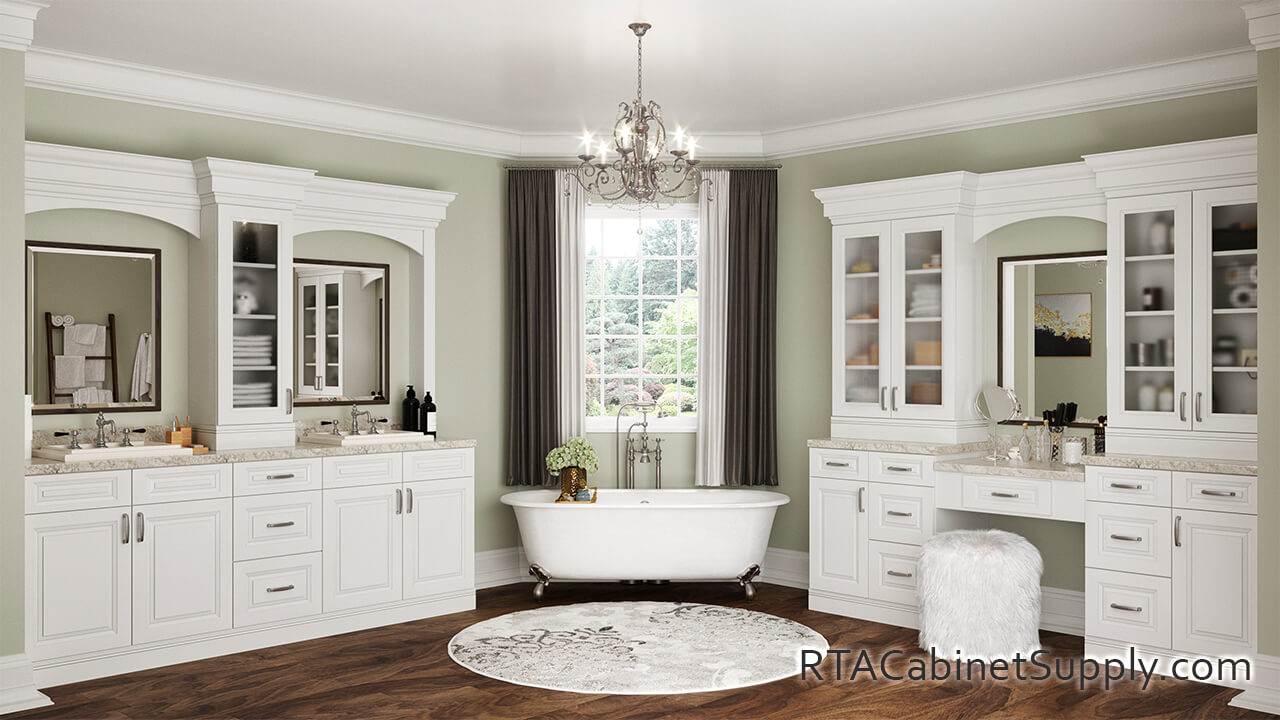 Newtown White bathroom full view with lighting, two sinks, glass door cabinets, wall and base cabinets.