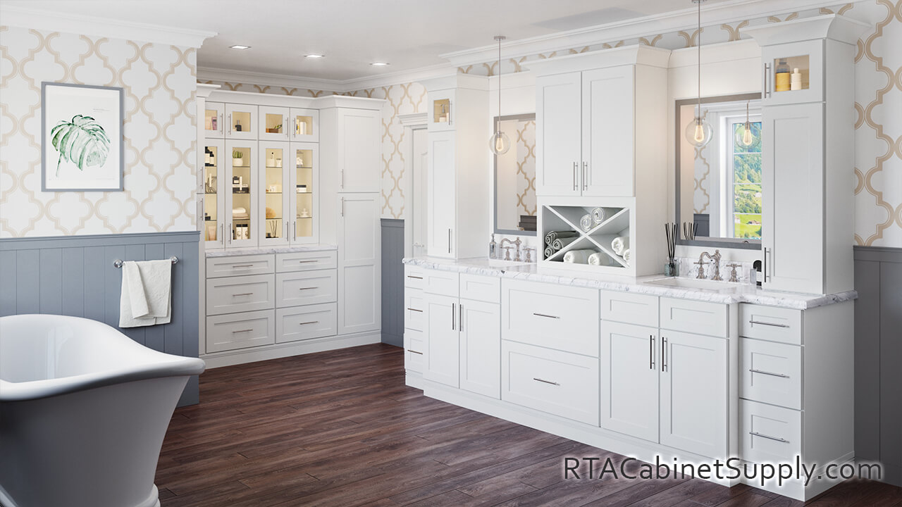 Salem White Shaker bathroom angle view with lighting, a bathtub, glass door cabinets, wall and base cabinets.
