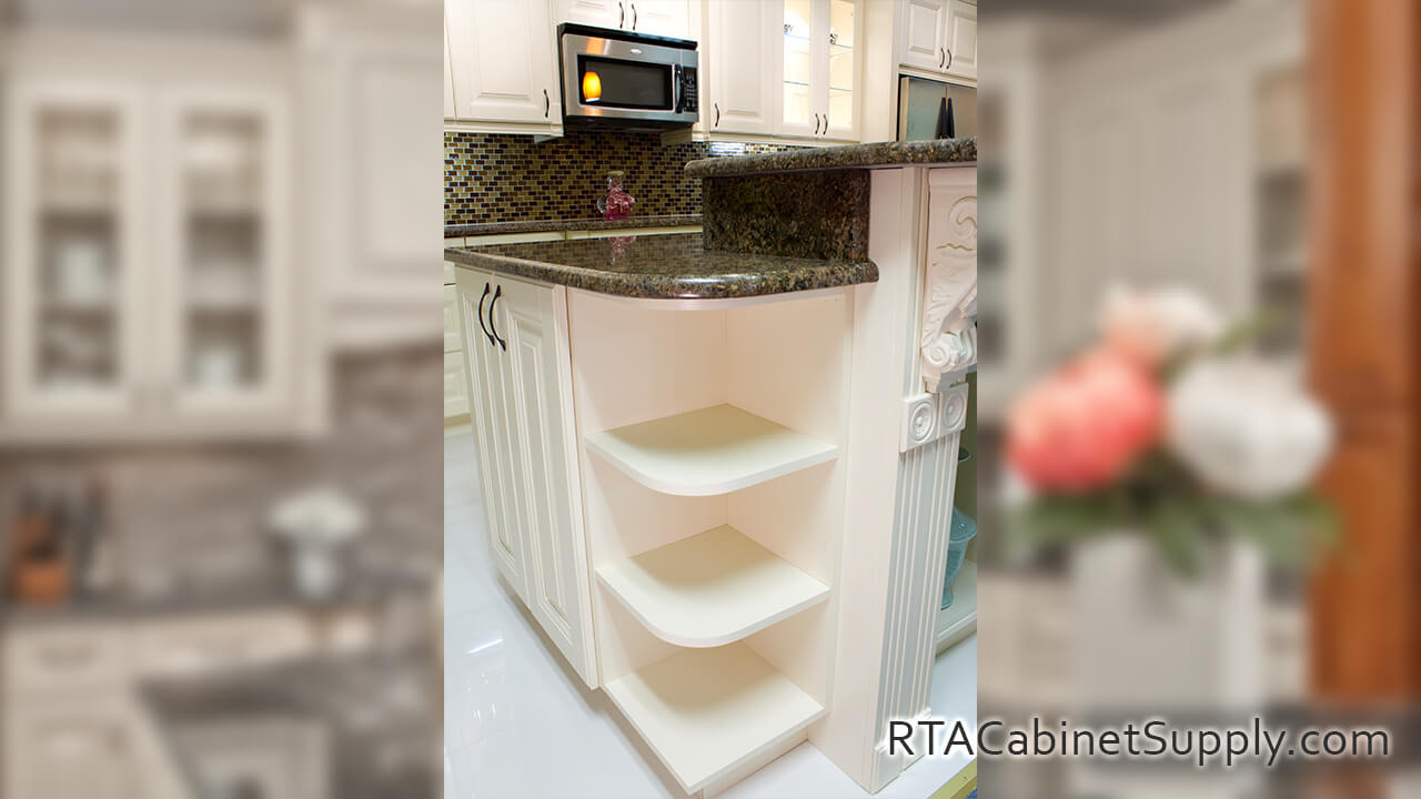 Holmdel Cream kitchen close up angle view with an island and open shelves.
