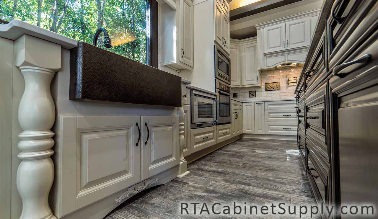 Oxfrord Cream kitchen close up view with a farmhouse sink cabinet, wall and base cabinets.