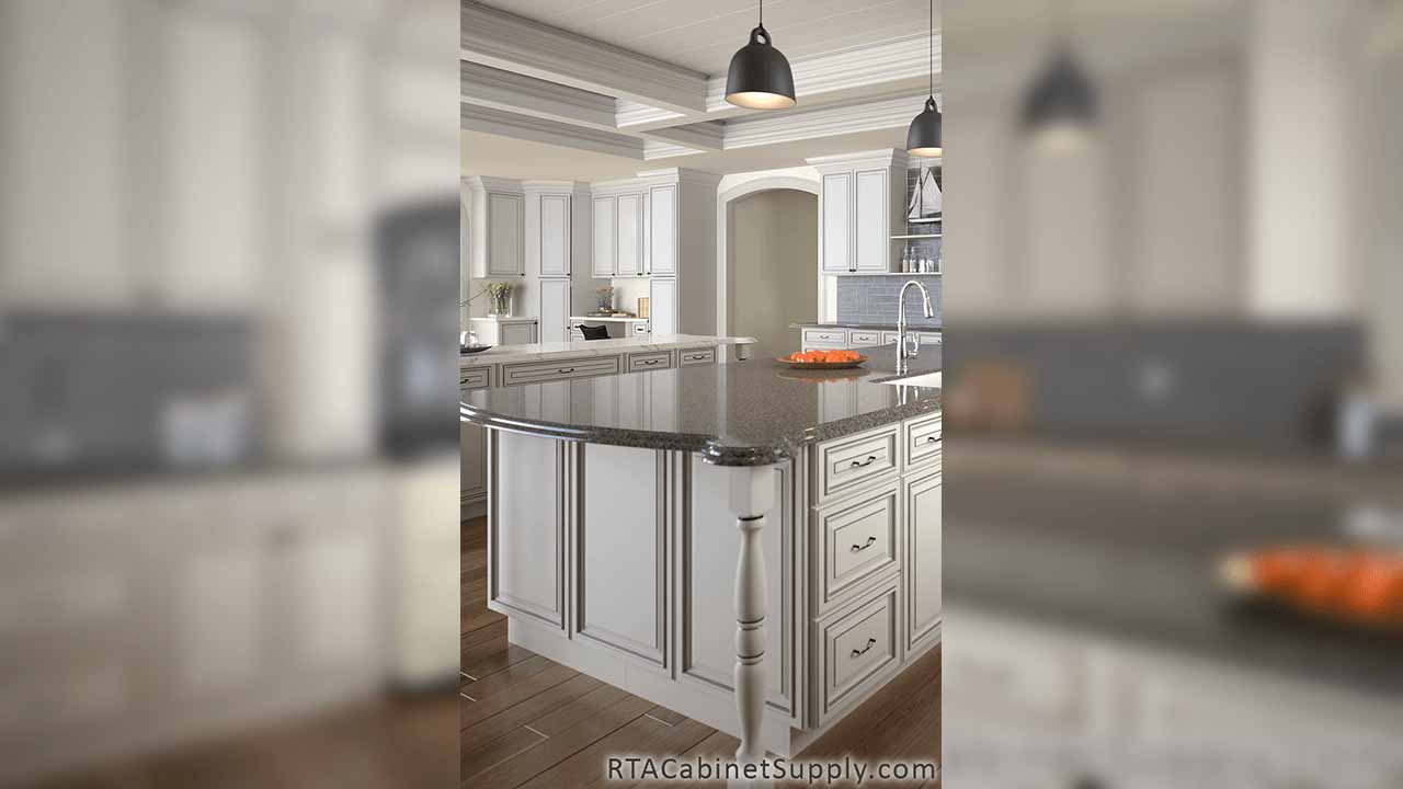 Pearl Glaze kitchen close up view with an island, lighting, wall and base cabinets.