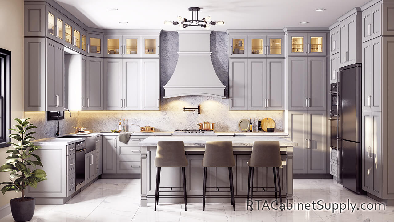 Preston Grey kitchen full view with glass door cabinets, an island, a countertop, a fridge, lighting, wall and base cabinets.