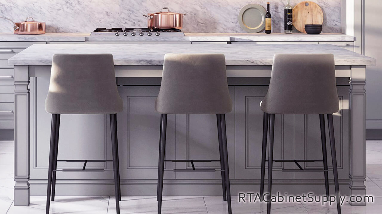 Preston Grey kitchen close up view with an island and chairs.