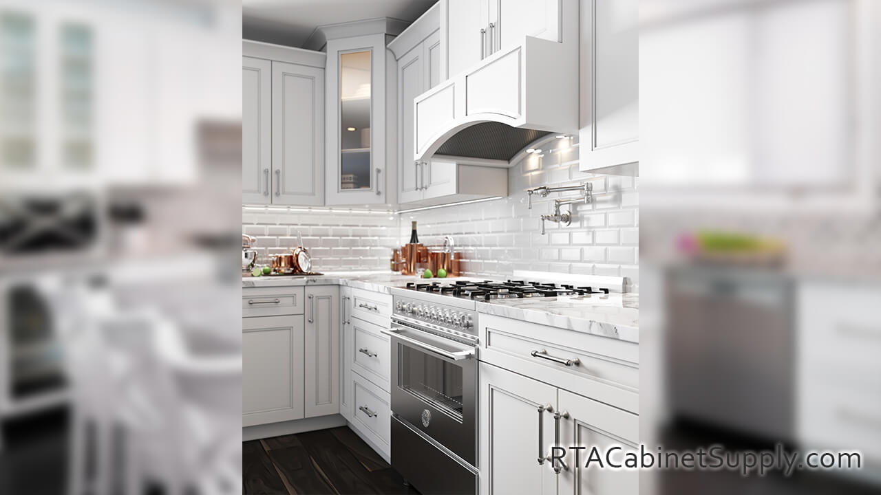 Preston White kitchen close up angle view with a range hood cover, a glass door cabinet, wall and base cabinets.