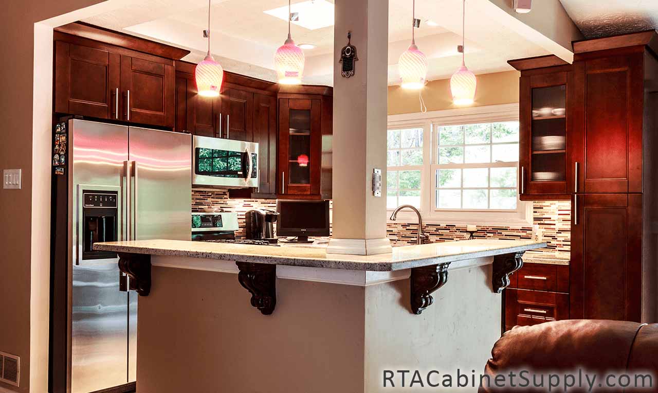 Walnut Shaker kitchen full angle view with a fridge, glass door cabinets, a countertop, lighting, wall and base cabinets.