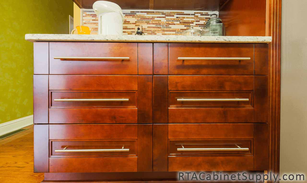 Walnut Shaker kitchen close up view with base cabinets.