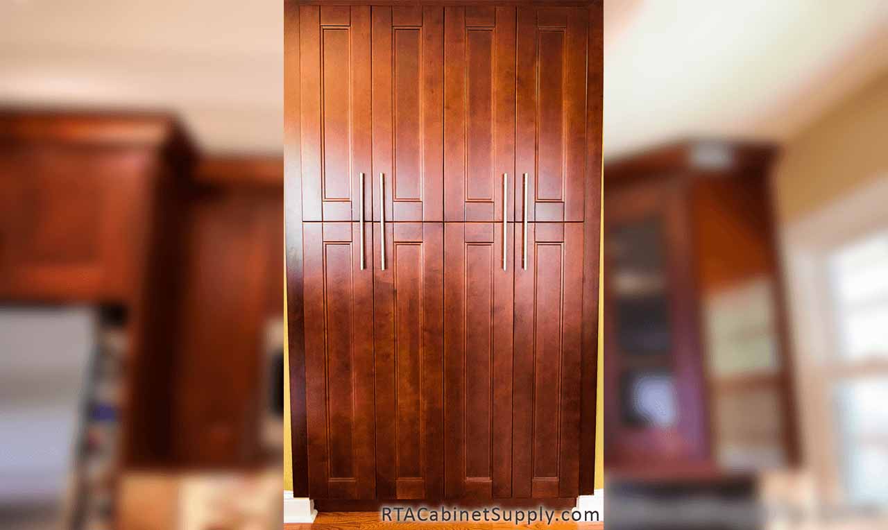 Walnut Shaker kitchen close up view with pantry cabinets.