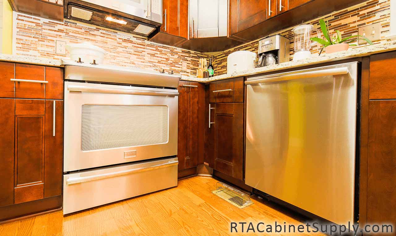 Walnut Shaker kitchen close up view with base cabinets.