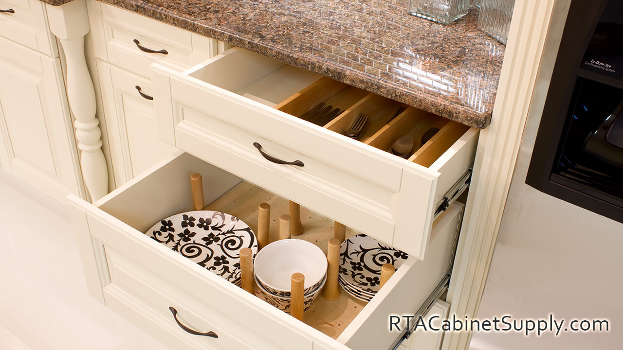 Holmdel Cream kitchen close up view with open roll-out sliding cabinet shelves.