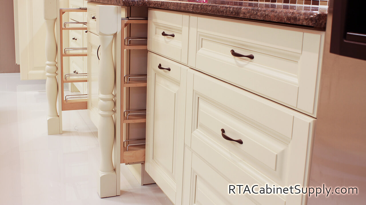 Holmdel Cream kitchen close up angle view with open base spice cabinets.