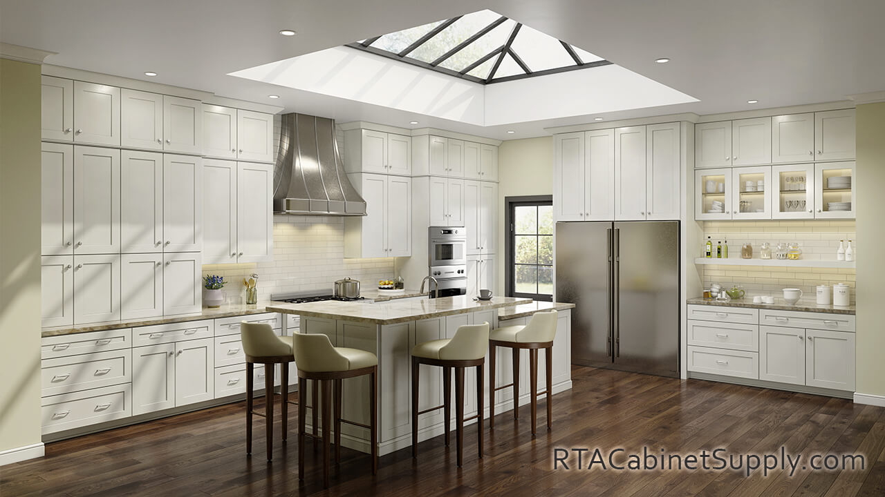 Camden Dove Shaker kitchen full angle view with an island, wall and base cabinets, lighting and glass door cabinets.