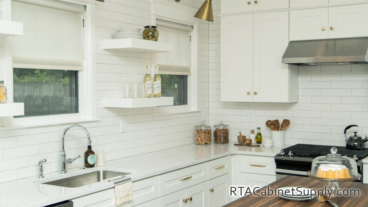 Camden Dove Shaker kitchen angle view with open shelving, a countertop, wall and base cabinets.