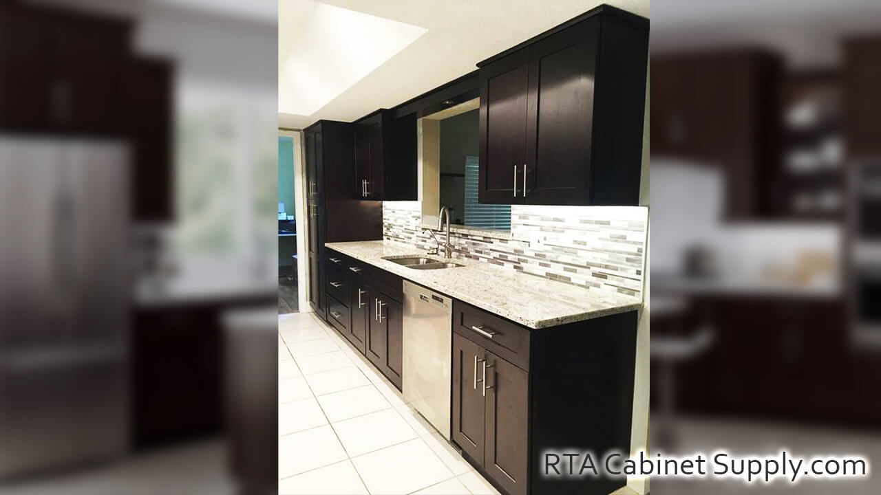 Camden Espresso Shaker kitchen angle view with a pantry cabinet, wall and base cabinets.