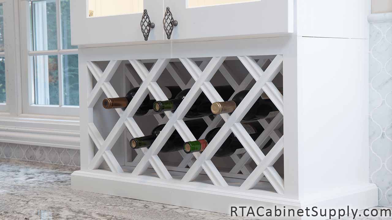 Classic White Shaker kitchen close up view with a wine rack cabinet.