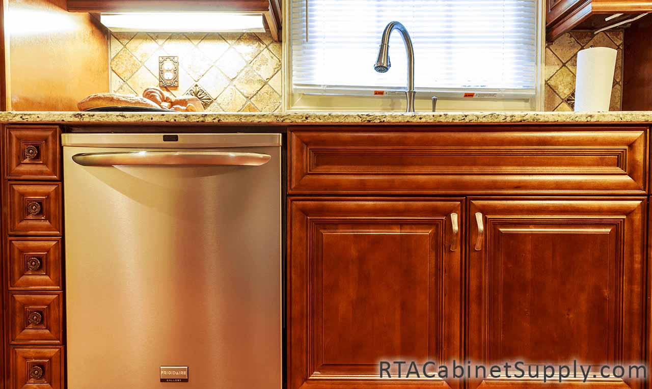 Coffee Cherry kitchen close up view with a faucet and base cabinets.