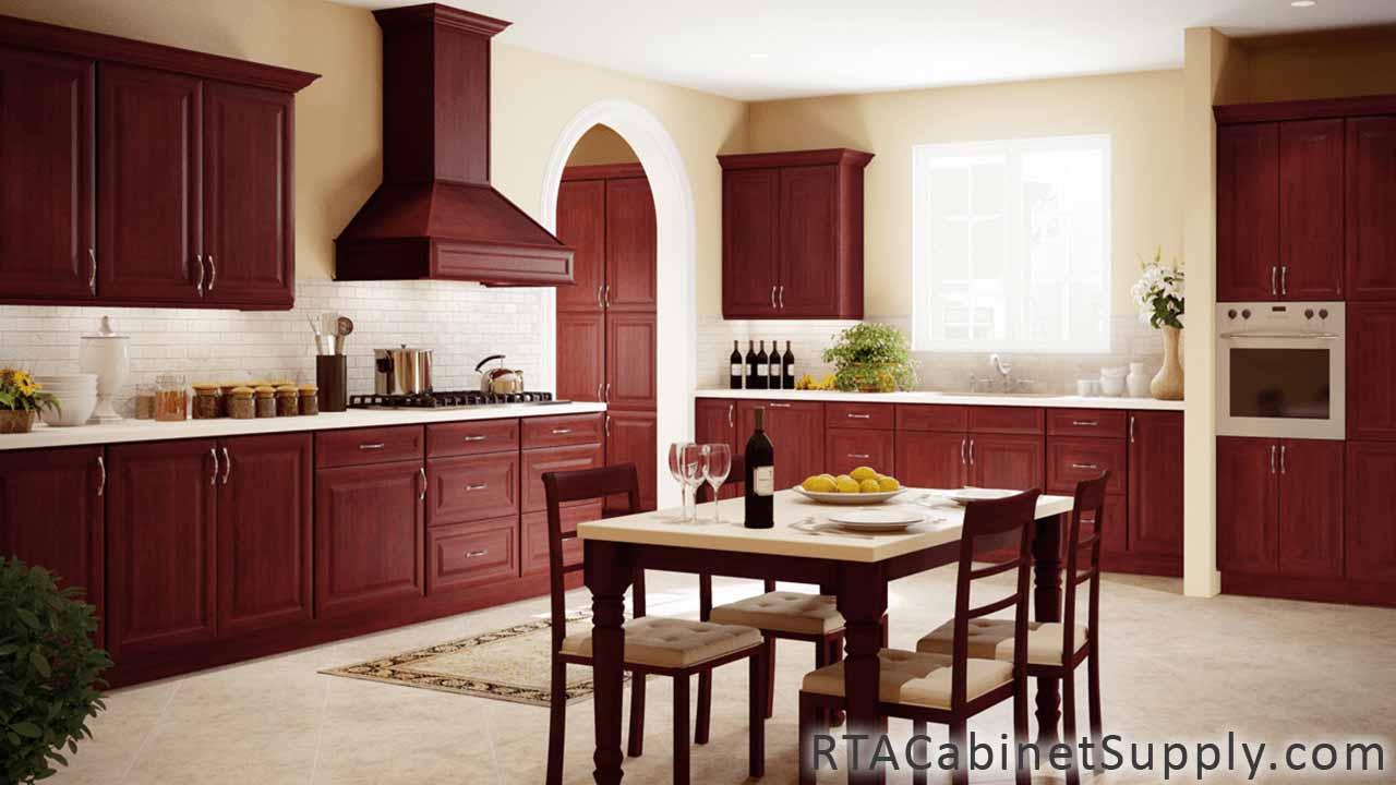 Concord Cherry Glaze kitchen full view with a range hood cover, a table, wall and base cabinets.