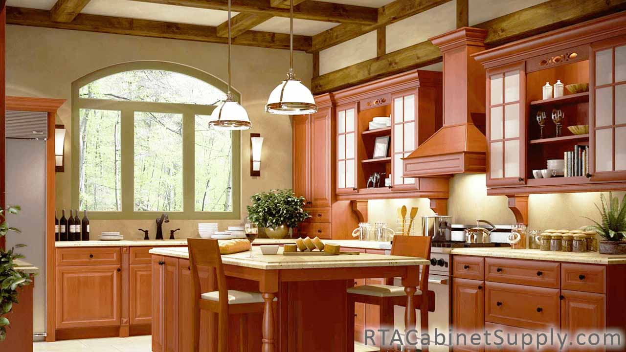 Concord Cinnamon Glaze kitchen angle view with a range hood cover, a table, glass door cabinets, wall and base cabinets.