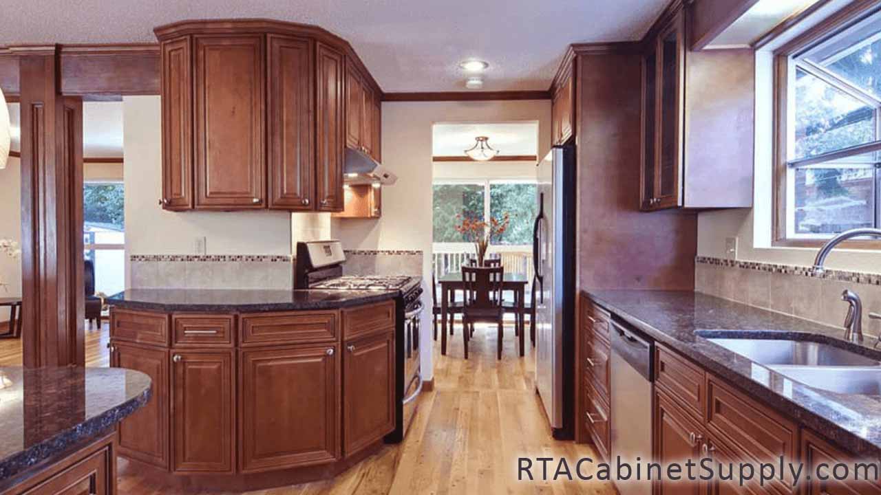 Coventry Toffee Glaze kitchen full view with a countertop, a sink, lighting, wall and base cabinets.