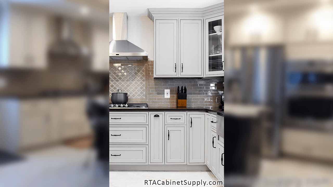 Dark Cream Glaze kitchen close up view with a range hood, wall and base cabinets.