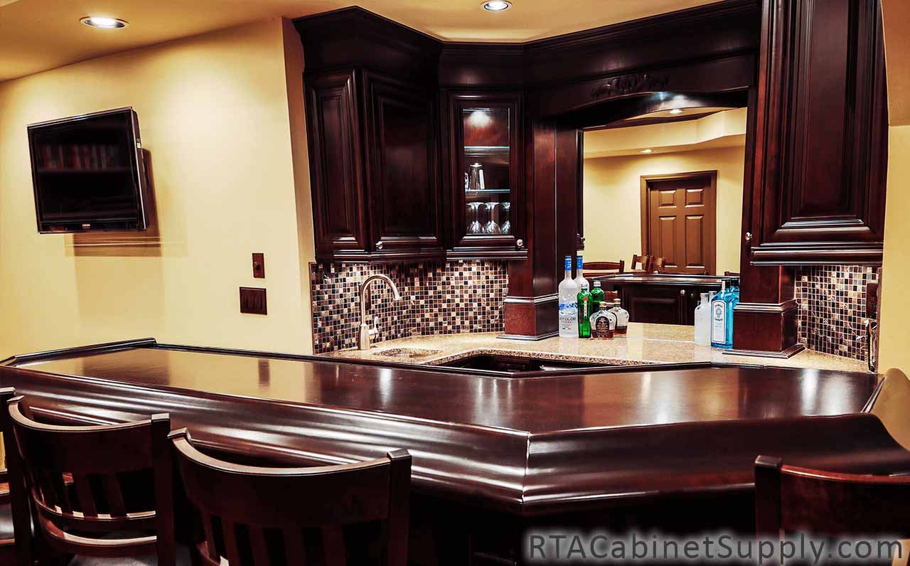 Edinburgh Espresso kitchen close up view with an island, chairs, a countertop and wall cabinets.