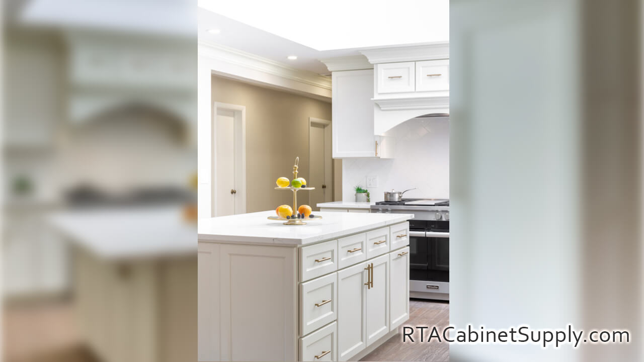 Hanover Dove kitchen close up angle view with an island, an oven, and a range hood cover.