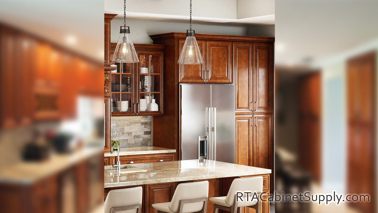 Hawick Chestnut Glaze kitchen close up view with a fridge, glass door cabinets, a countertop, lighting, wall and base cabinets.