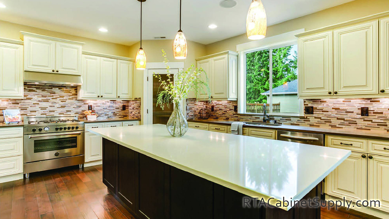 Vanilla Glaze kitchen close up angle view with an island, wall and base cabinets and an oven.
