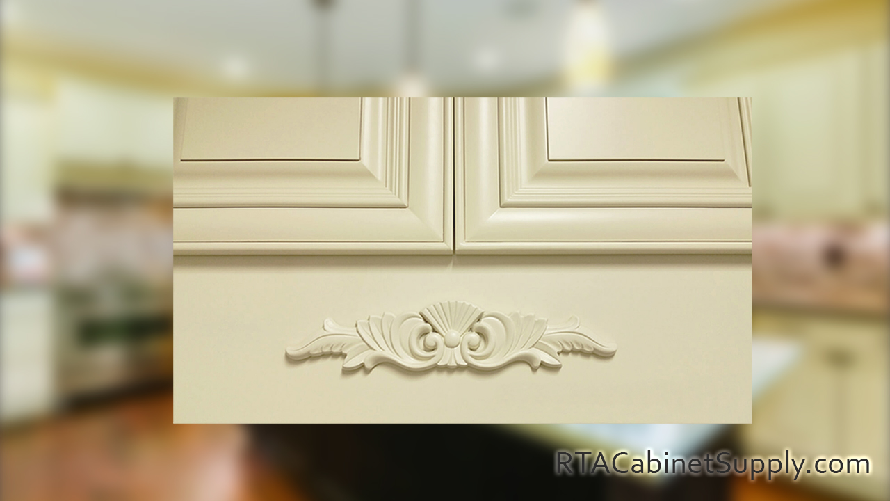Vanilla Glaze kitchen close up view with a wall cabinet and a wood carving.
