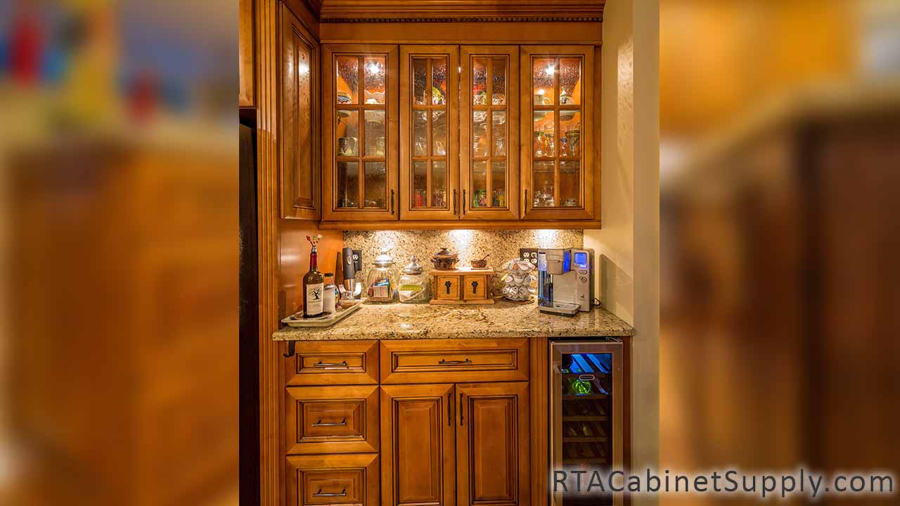 Kingston Maple kitchen close up view with a countertop, glass door cabinets and base cabinets.