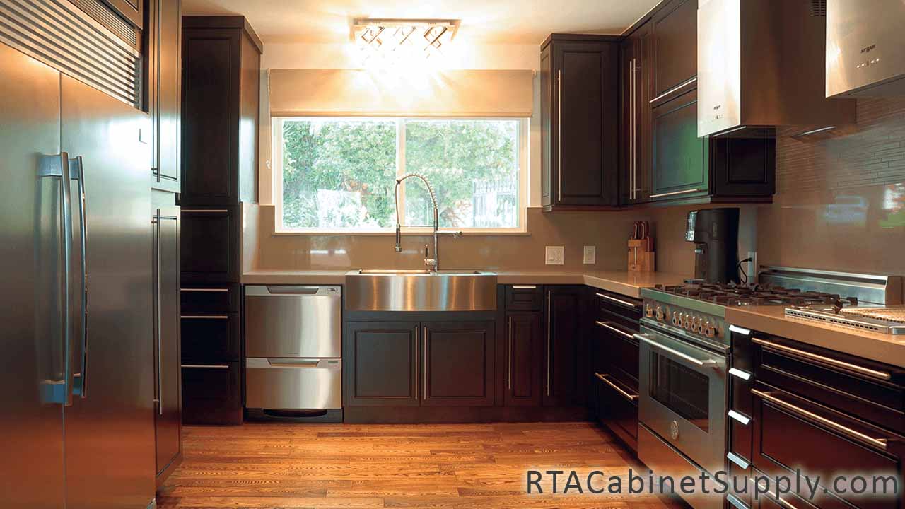 Modern Espresso kitchen full view with a fridge, a farmhouse sink cabinet, wall and base cabinets.