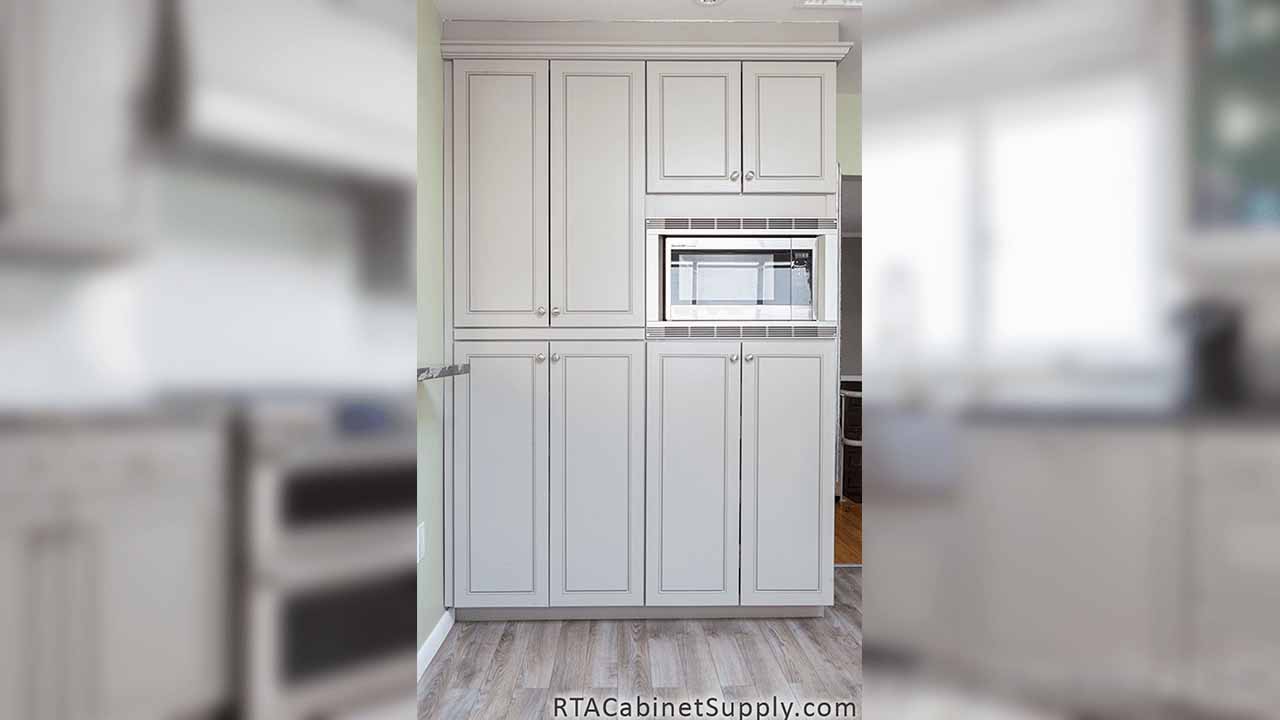 Modern Grey kitchen close up view with pantry cabinets.