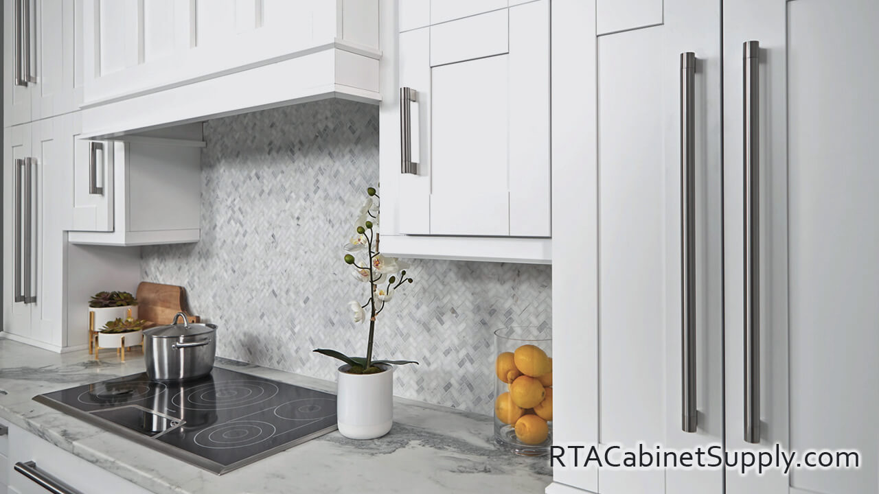 Modern White Shaker kitchen close up angle view with a countertop, and wall cabinets.
