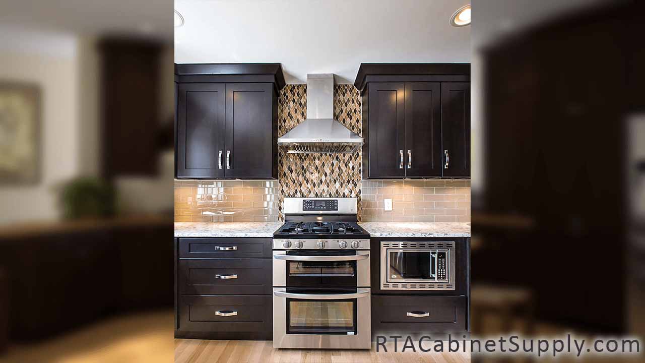 Newport Espresso Shaker kitchen close up view with an oven, a countertop, wall and base cabinets.